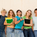 group of teens students hanging out at school